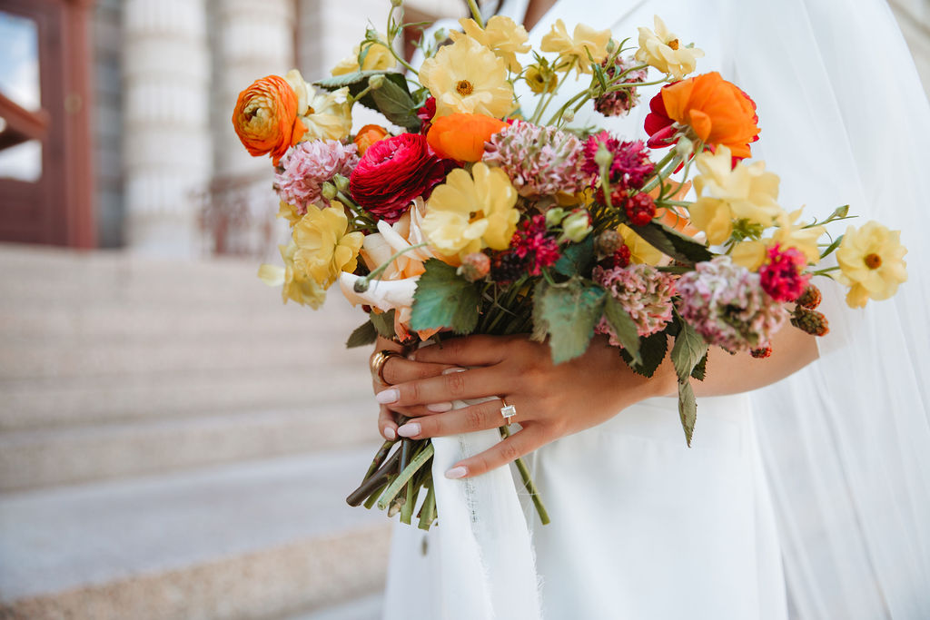 modern wedding flowers and emerald cut ring